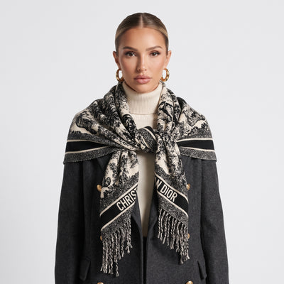 Black and ivory Christian Dior shawl with logo band and fringed edges