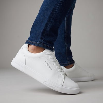 Calvin Klein white low-top sneakers with rubber sole and subtle branding