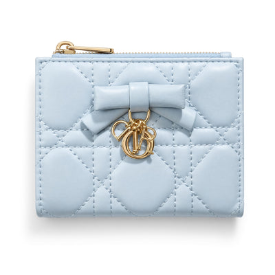 Light blue Dior compact quilted wallet with bow charm and zip pocket