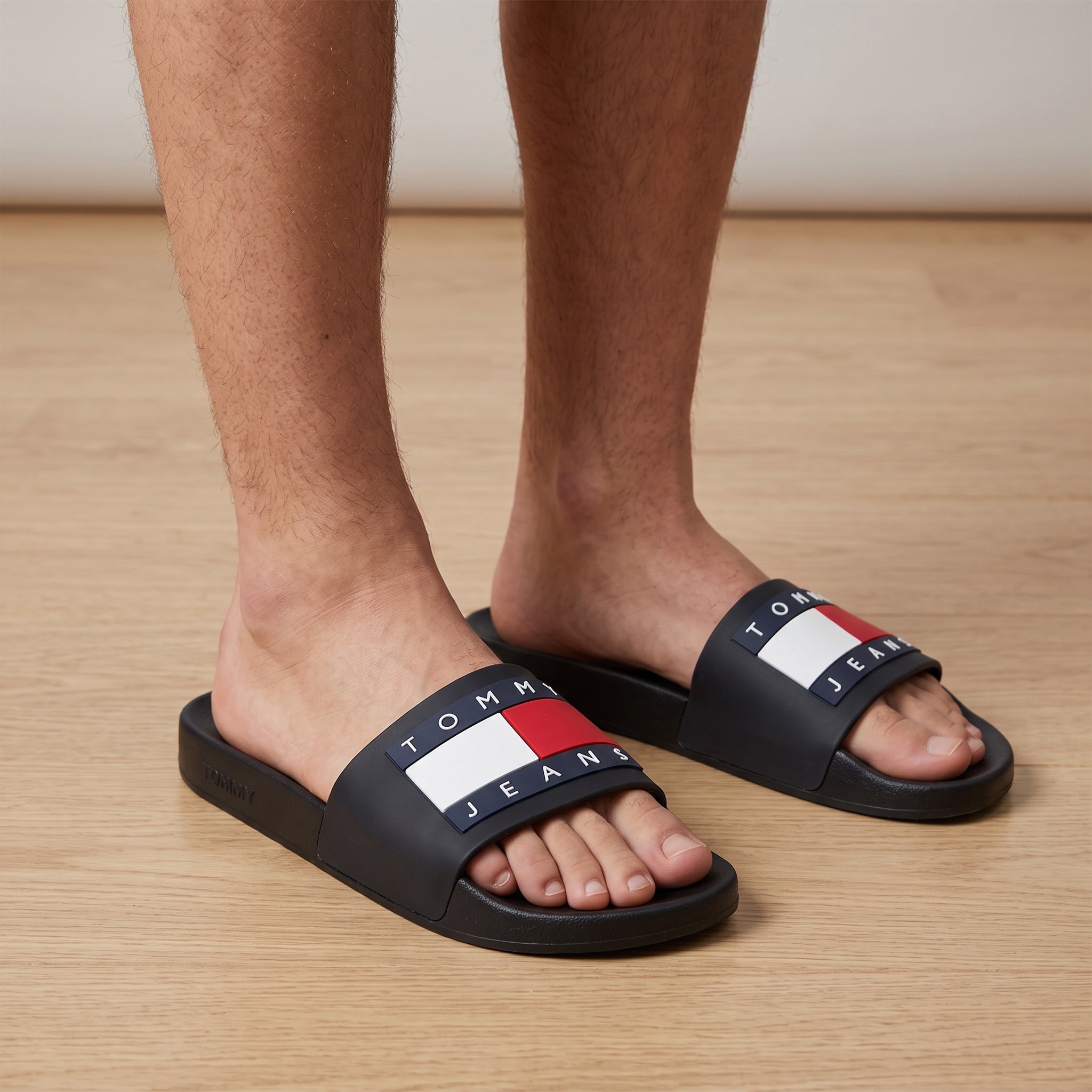 Tommy Jeans navy slides with red white blue flag logo on strap