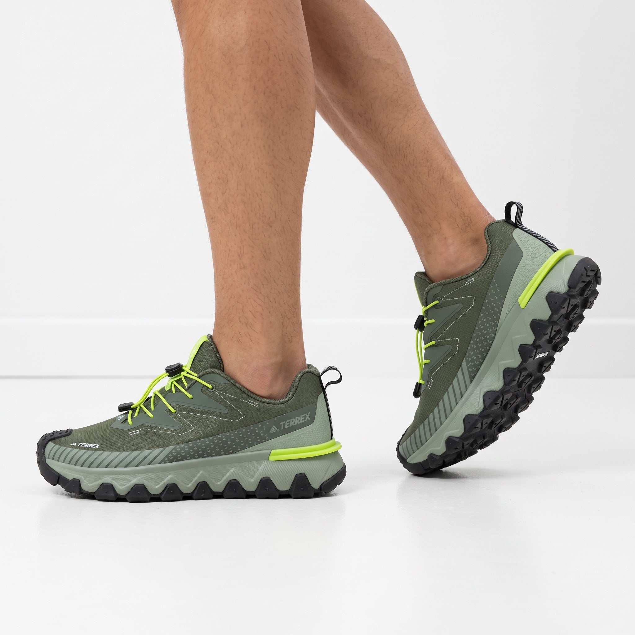 Adidas Terrex olive green trail sneaker with neon laces and rugged lug sole