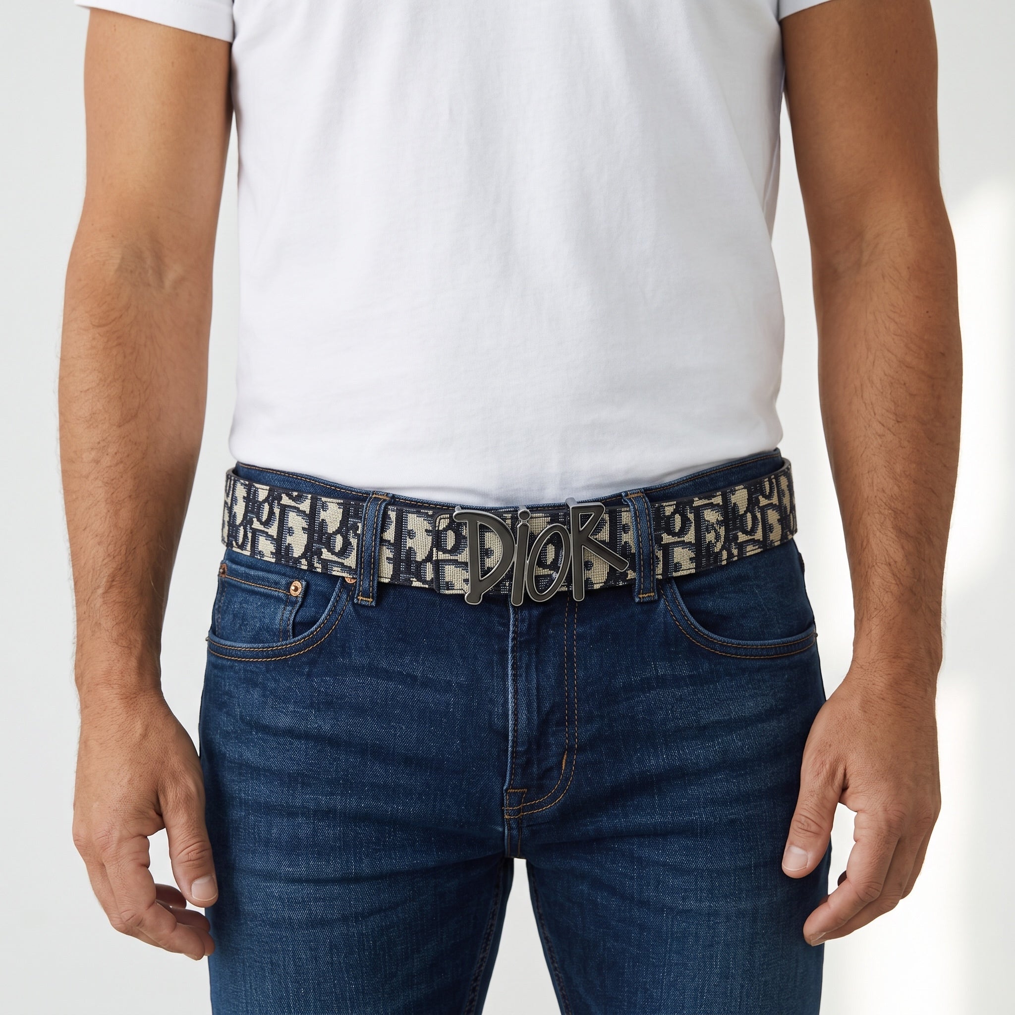 Dior Oblique navy monogram belt with Dior logo buckle on jeans
