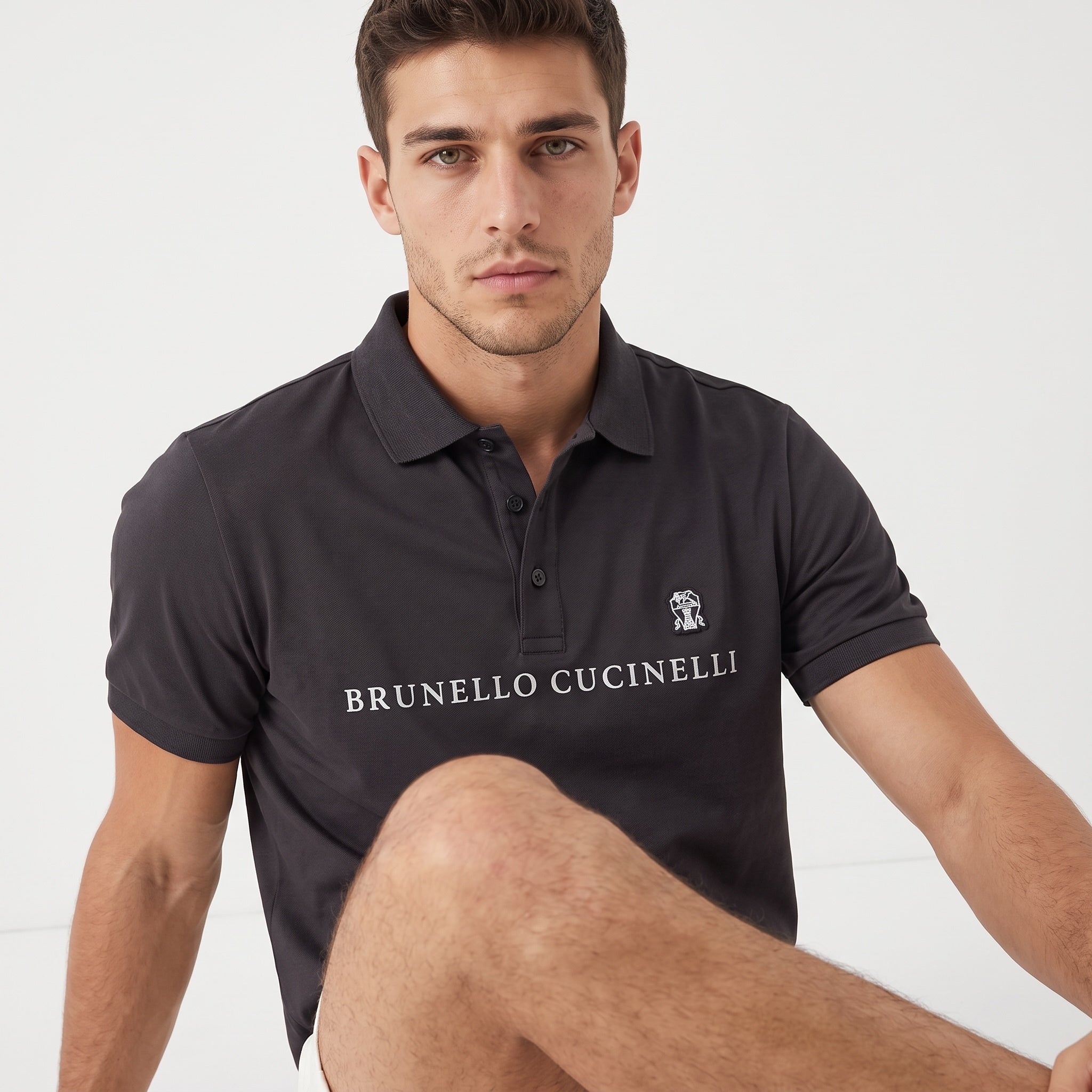 Brunello Cucinelli charcoal polo with chest logo and embroidered crest