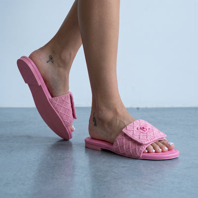 pink quilted Chanel slide with CC logo on a footbed