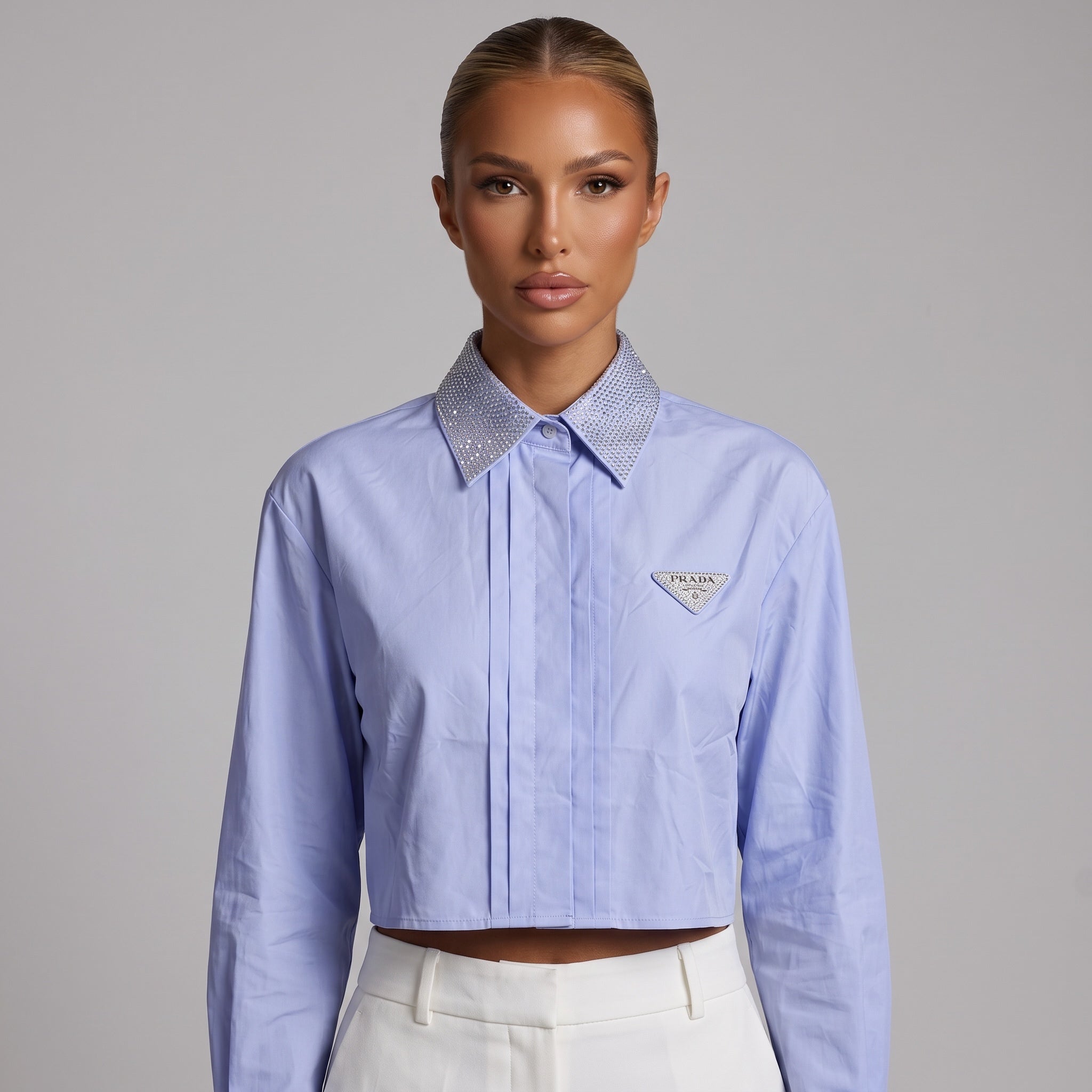Prada light blue cropped shirt with crystal‑embellished collar and Prada triangle patch