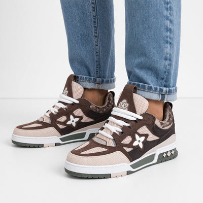 brown and beige Louis Vuitton chunky trainer with LV floral motif and green sole