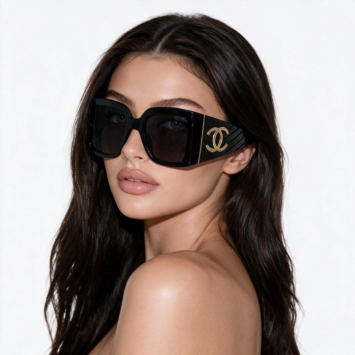 Oversized black square Chanel sunglasses with gold CC logo on temples