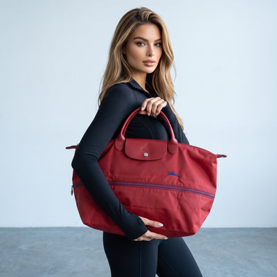 red Longchamp Le Pliage large tote with leather flap and handles