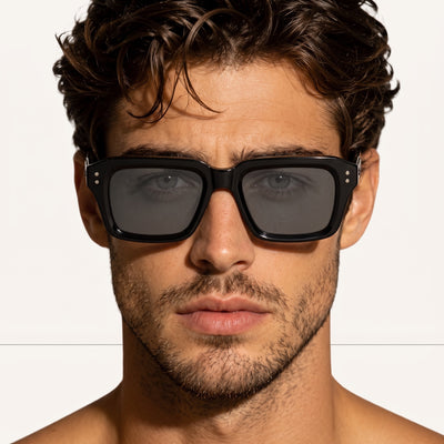 Close-up black square polarized sunglasses on male model