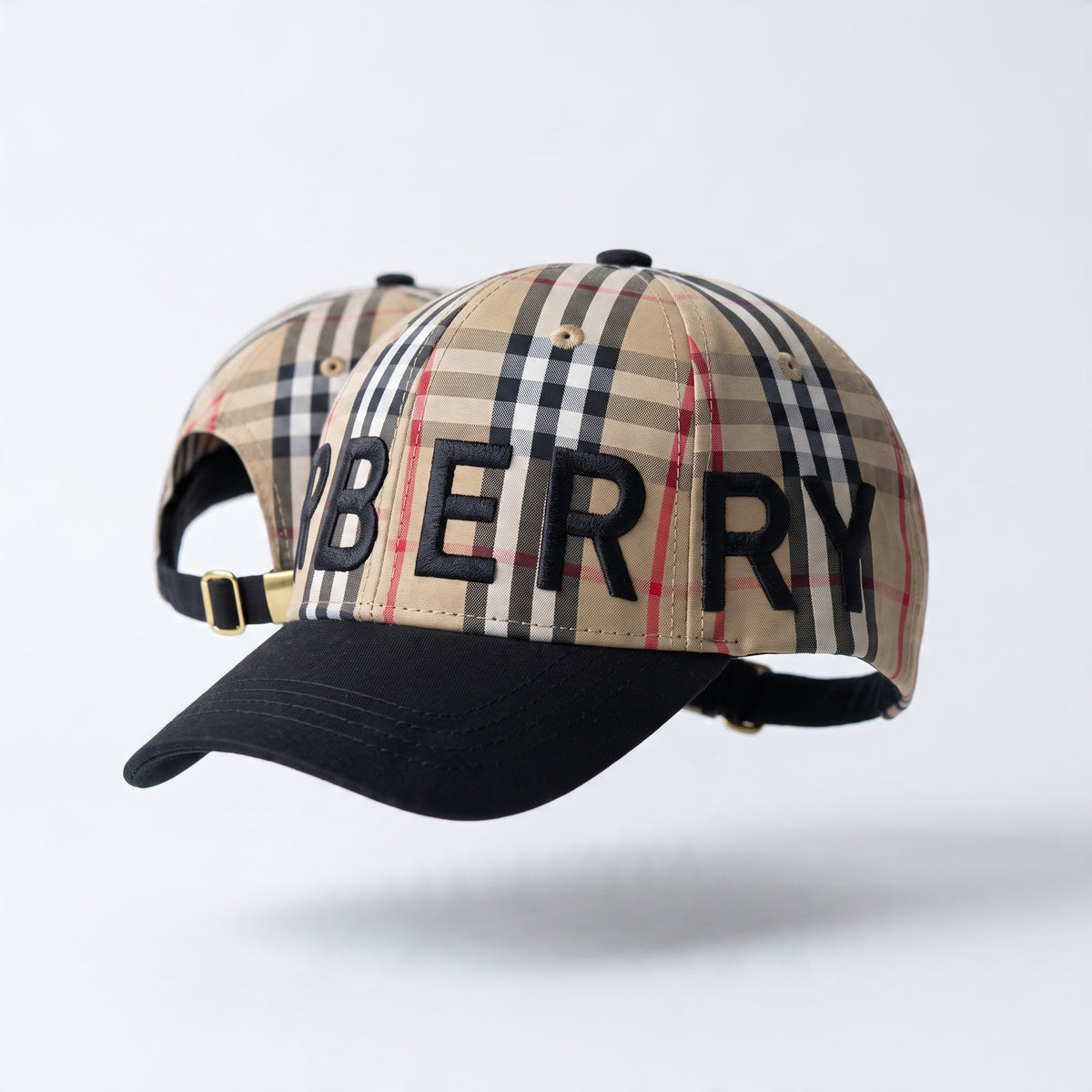 Burberry baseball cap with beige check crown and black brim showing embroidered BURBERRY logo
