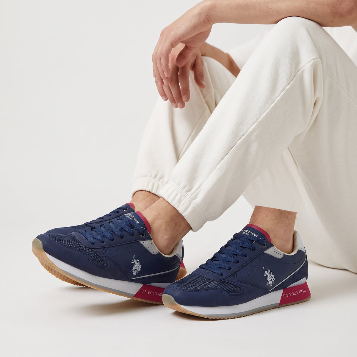 U.S. Polo Assn. navy low-top sneakers with white and pink accents