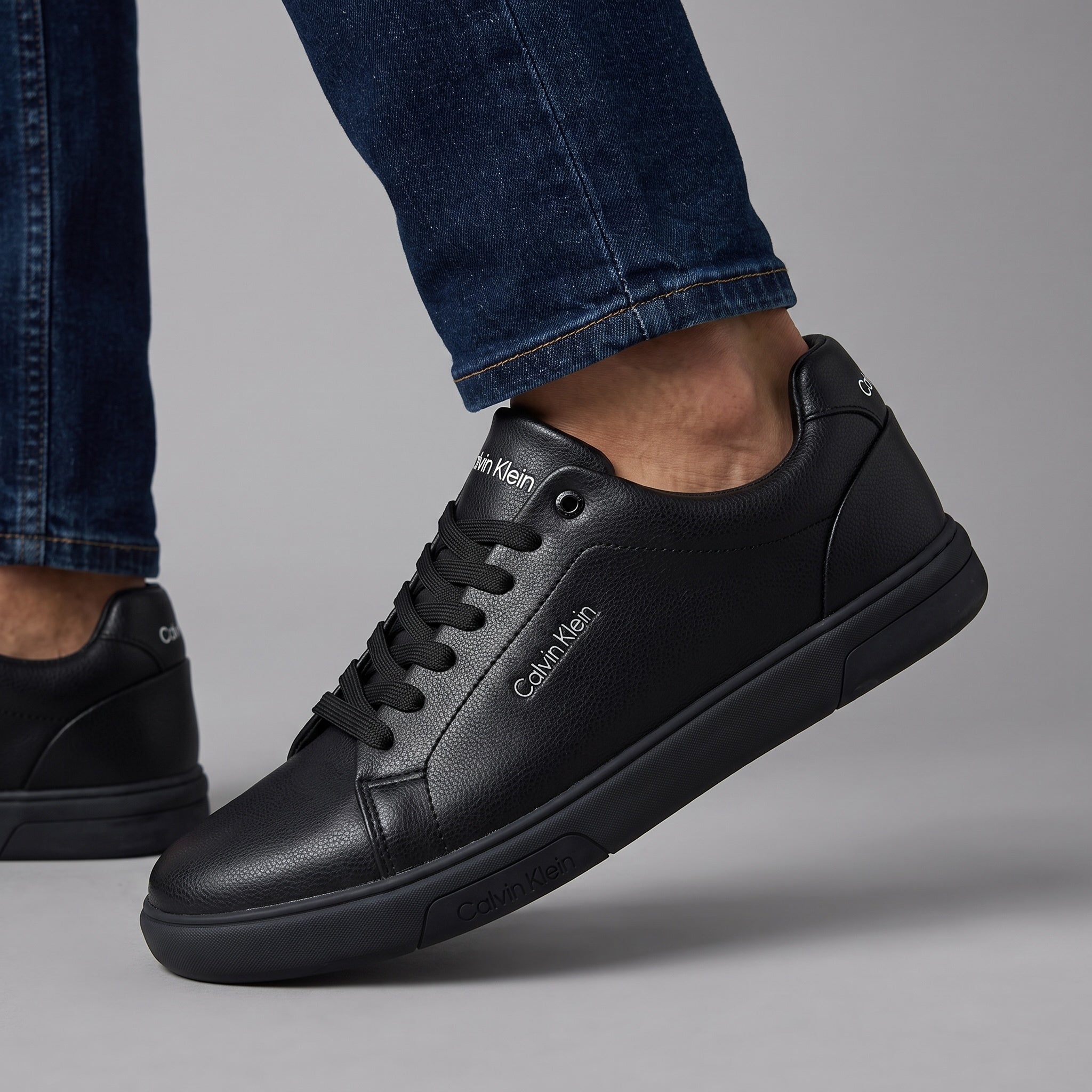 Calvin Klein black low-top sneakers with textured pebbled upper