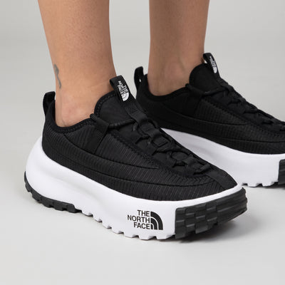 The North Face black platform trail runner with white chunky midsole and lugged outsole