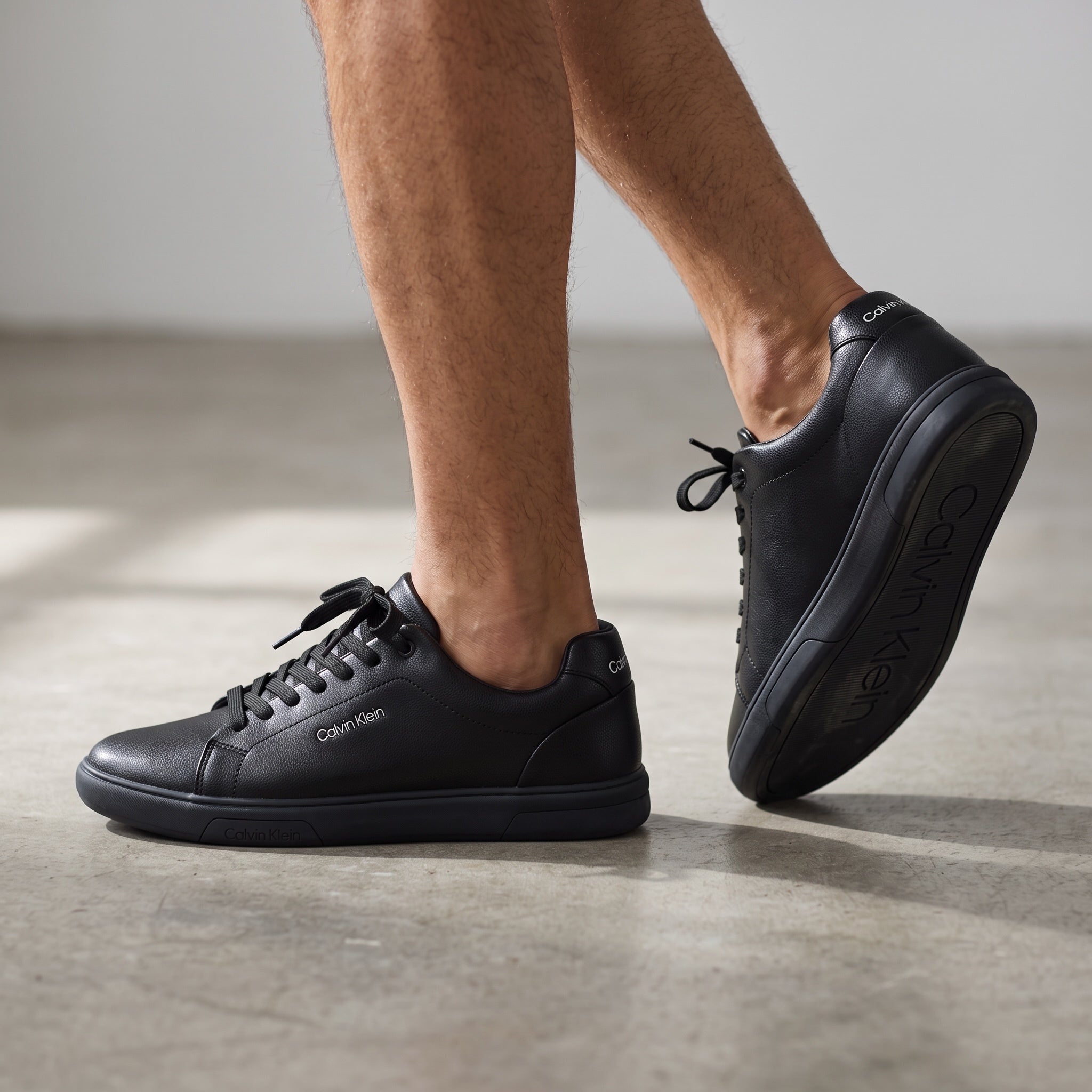 Calvin Klein black low-top sneakers with textured pebbled upper