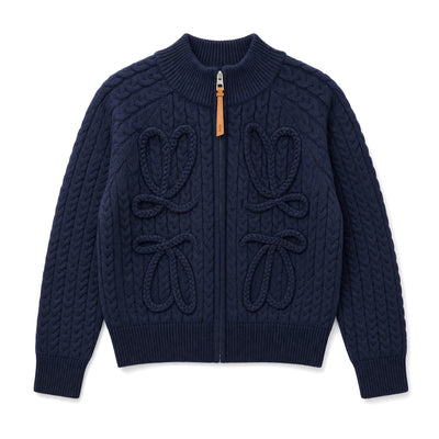 Navy cable-knit zip jacket with braided bow details and leather zipper pull