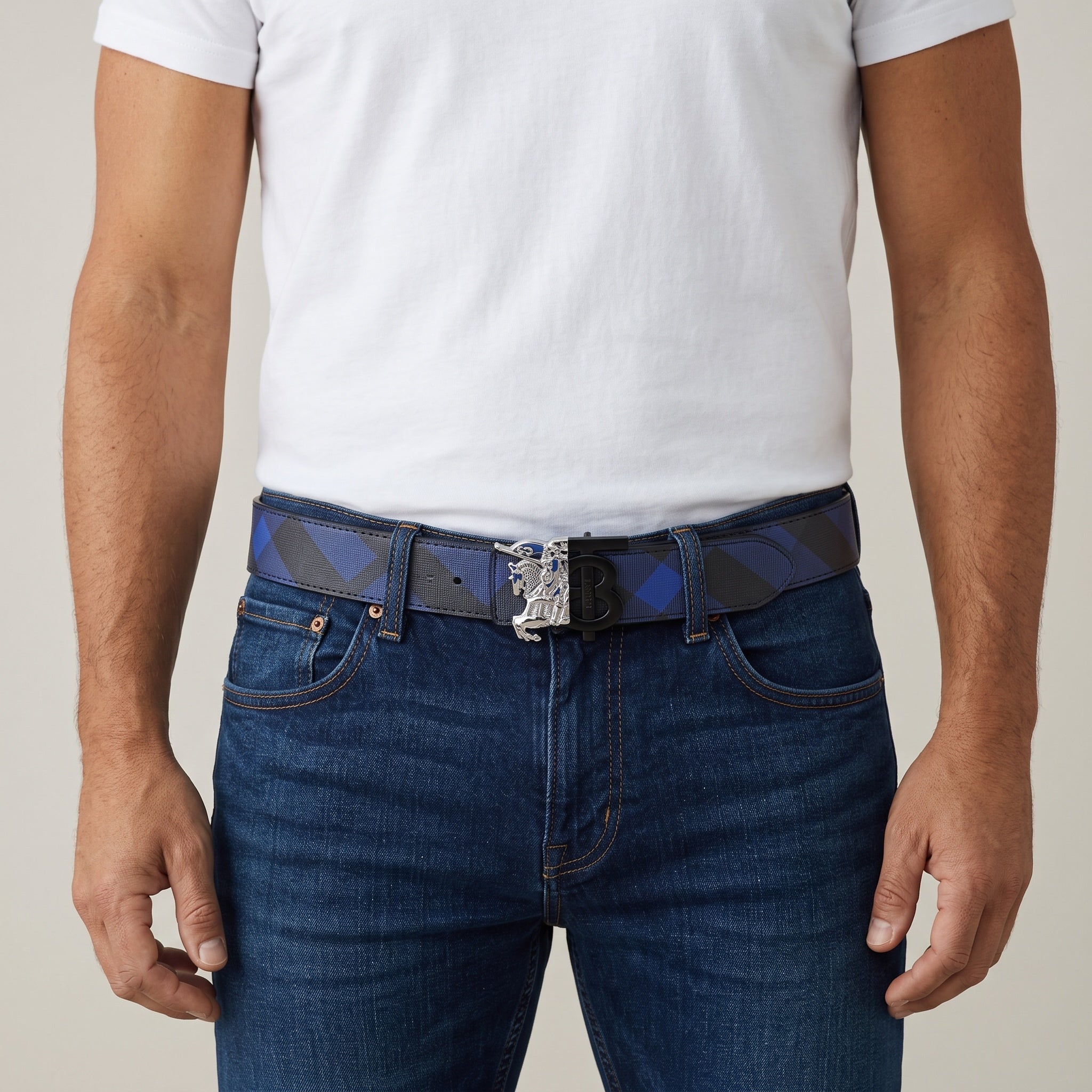 Blue check Burberry belt with equestrian B buckle worn with jeans
