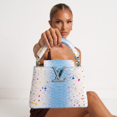Louis Vuitton small top-handle bag in sky blue and white with paint splatter and gold hardware