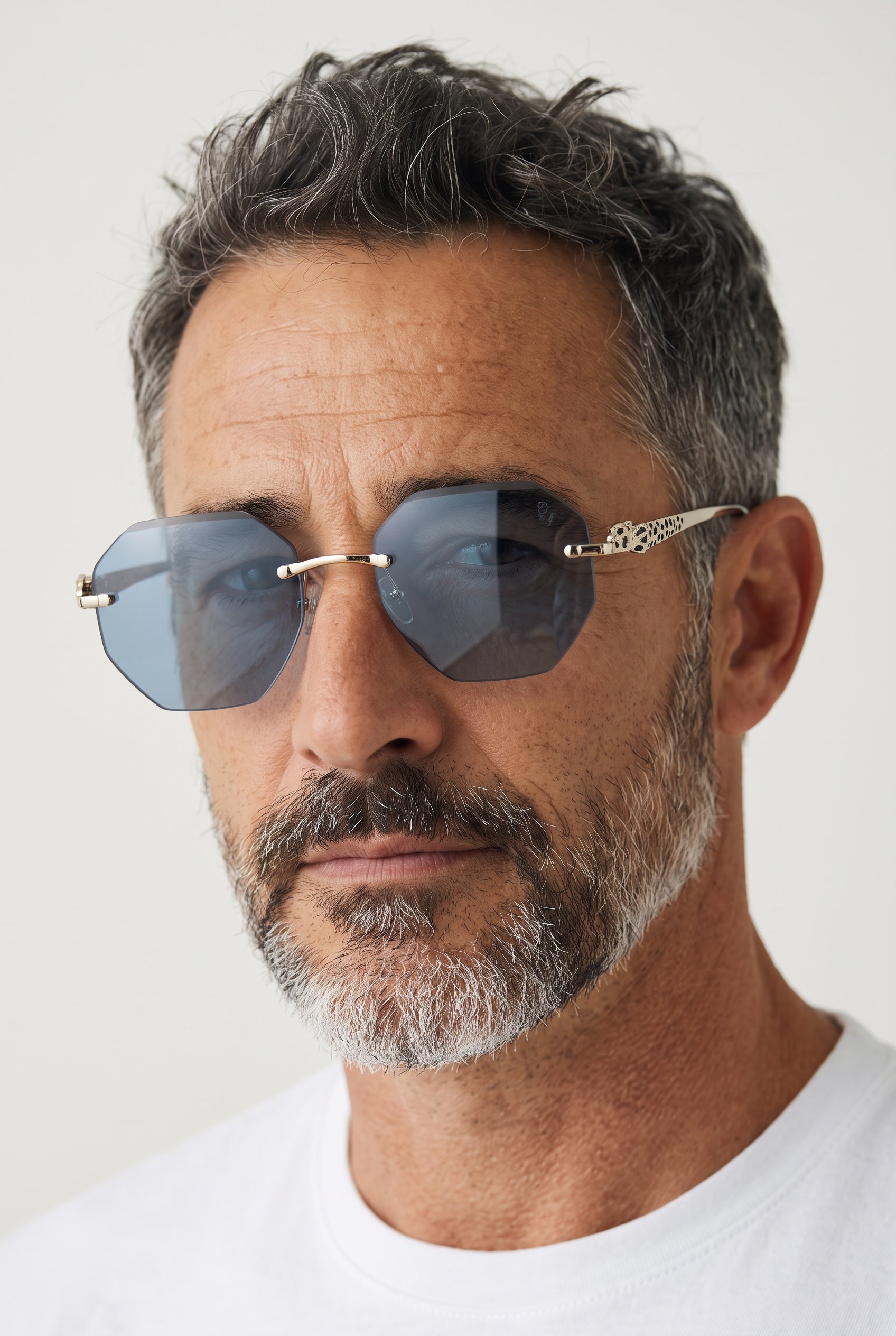 Cartier rimless octagonal blue sunglasses with gold panther-detail temples