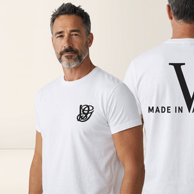 White Valentino T-shirt with small black chest monogram and large black V with MADE IN VALENTINO on back