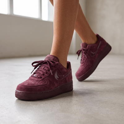 Nike Air Force 1 Low maroon suede sneakers with glossy swoosh