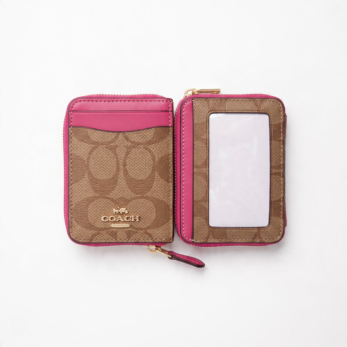 Coach zip-around phone wallet in brown signature print with pink trim and clear ID window
