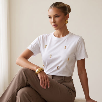 White Saint Laurent T-shirt with multiple small gold YSL logo studs on the front