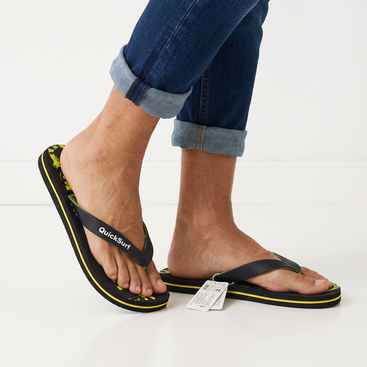 QuickSurf black flip flops with neon green camo footbed and branded strap