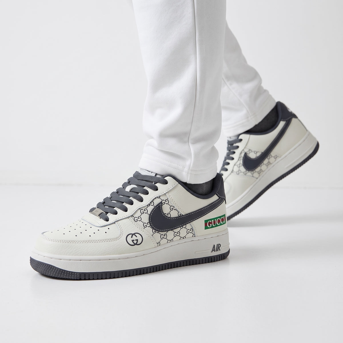 Gucci Air Force 1 low-top sneaker with GG monogram print and dark grey swoosh