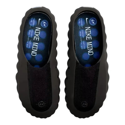 Black Nike Mind slip-on clog with blue circular pods on the sole