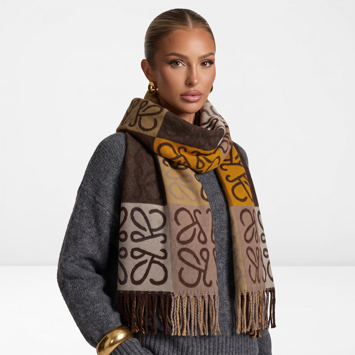 Brown and mustard Loewe anagram logo scarf with fringed ends wrapped around model