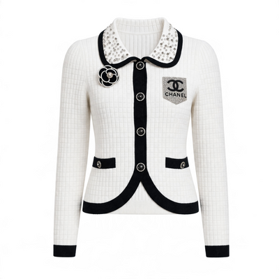 White Chanel cardigan jacket with black trim, jewel collar, camellia brooch and CC patch