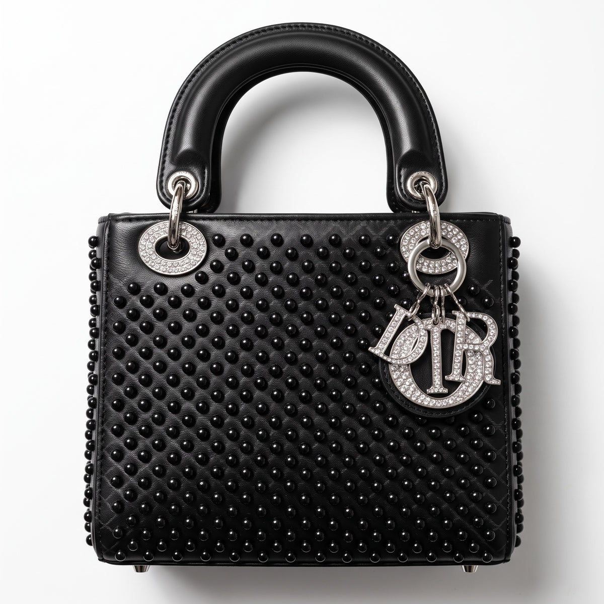 Black Dior Lady bag with studs and crystal Dior charms, top handles visible