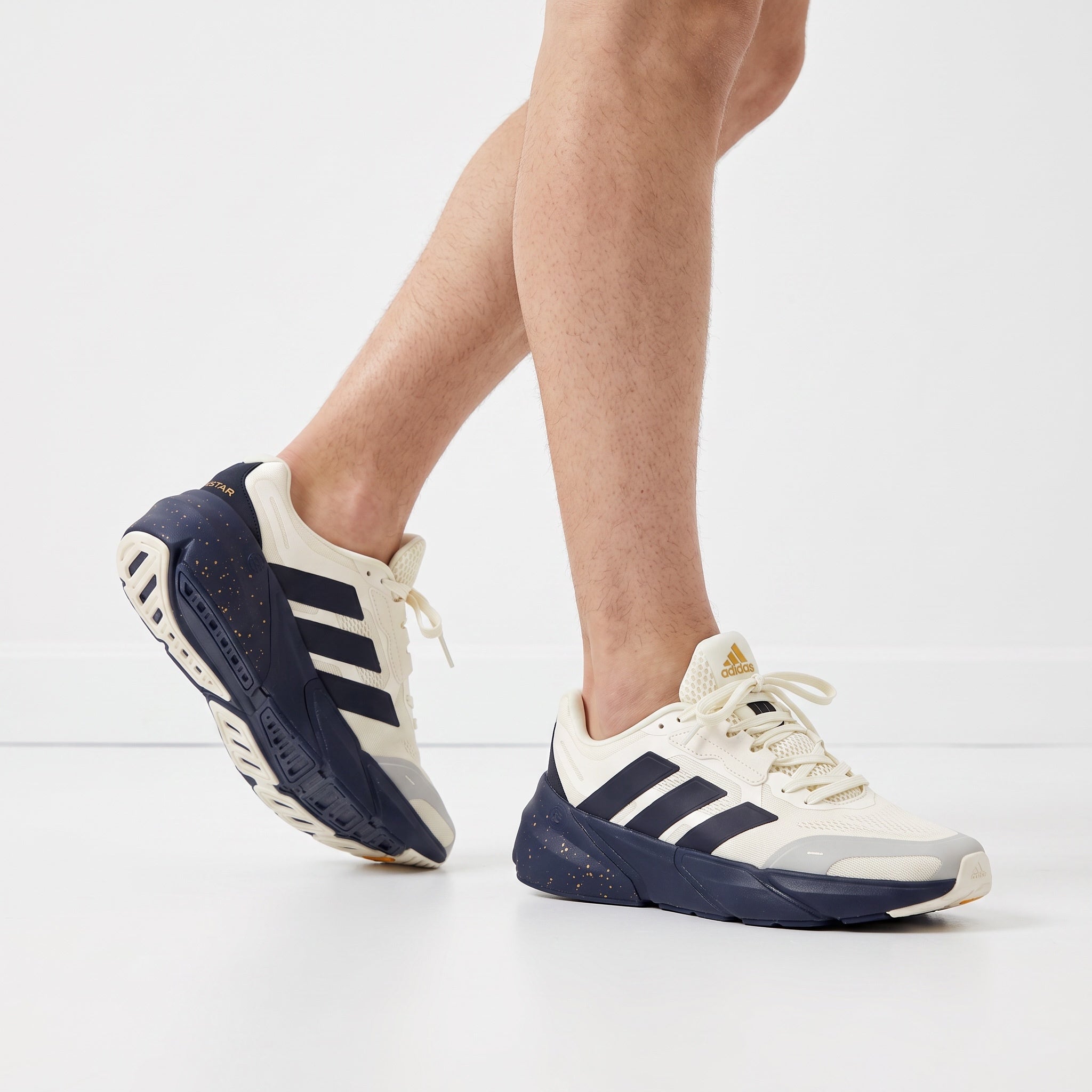Cream and navy adidas chunky sneakers with speckled navy midsole