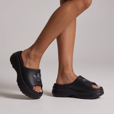 black adidas platform slide sandal with embossed trefoil