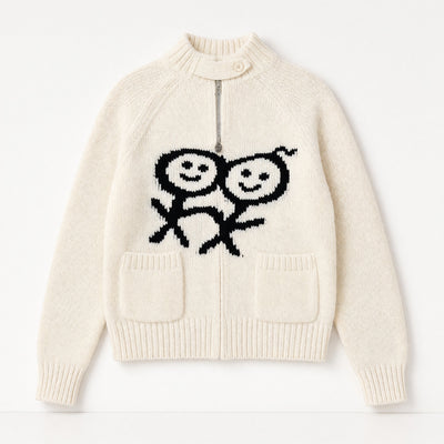 Cream zip knit sweater with black smiley motif and front pockets