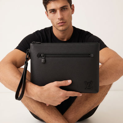 Black Louis Vuitton pouch with wrist strap and tonal LV logo