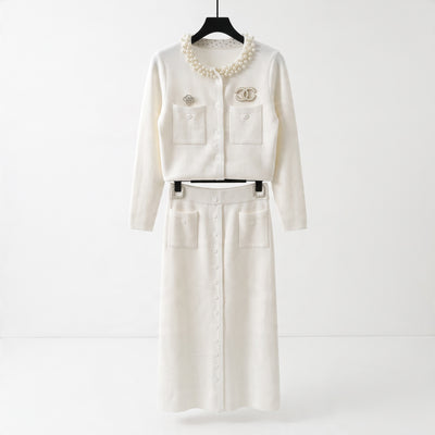 Cream cropped cardigan with pearl collar, chest pockets and decorative brooches
