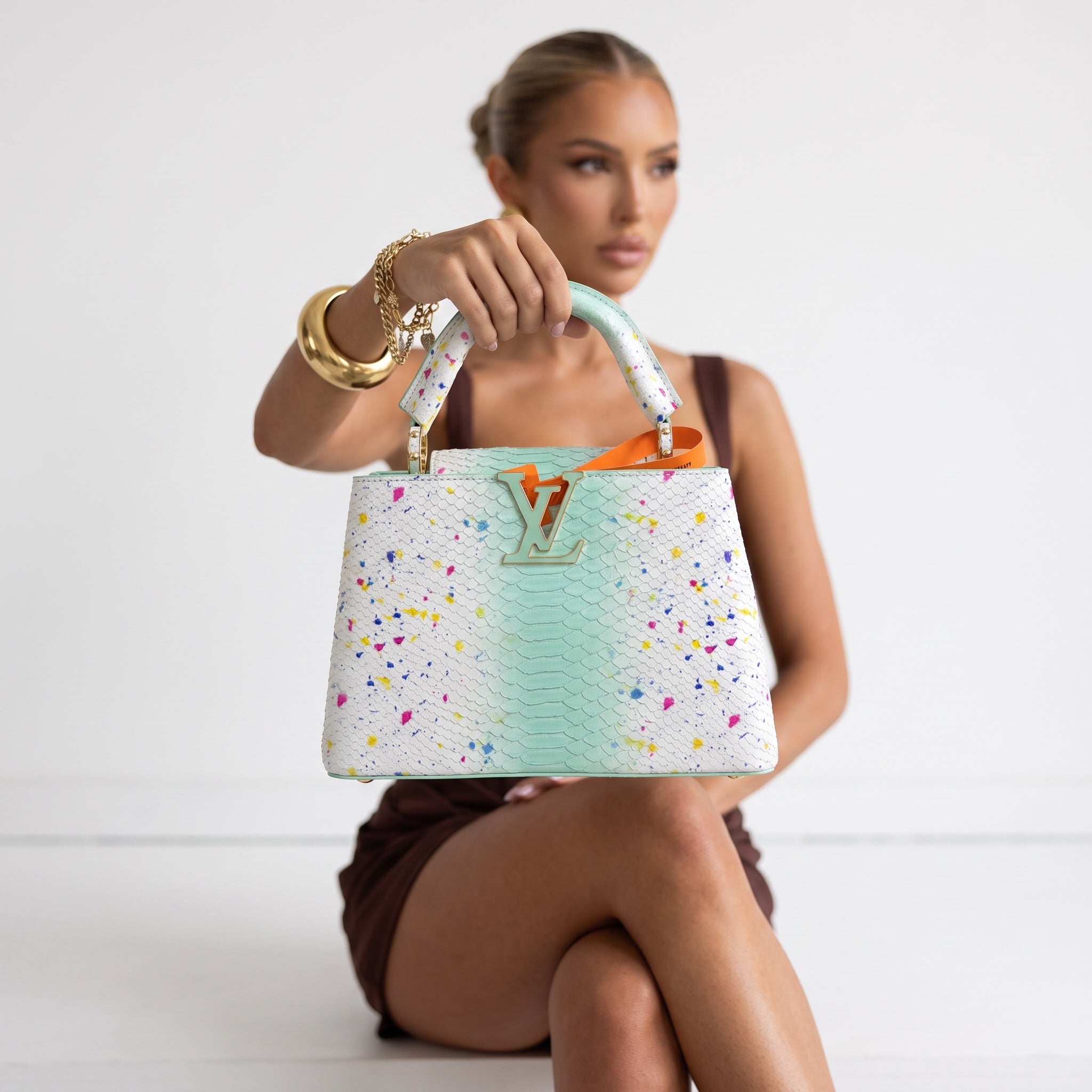 Louis Vuitton mint and white top-handle bag with multicolor speckle and gold LV clasp