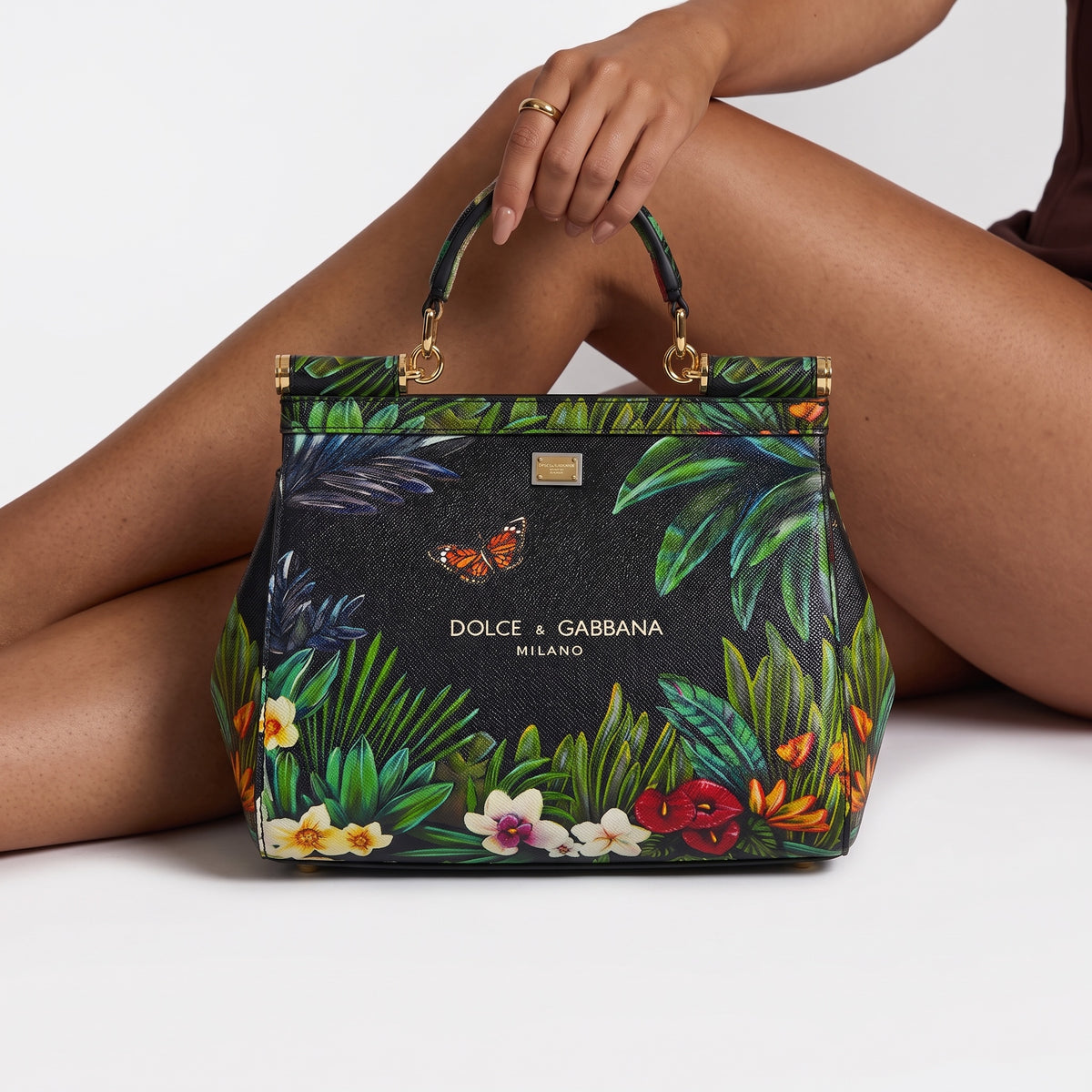 Dolce & Gabbana black Sicily top-handle bag with colourful tropical floral and butterfly print and gold hardware