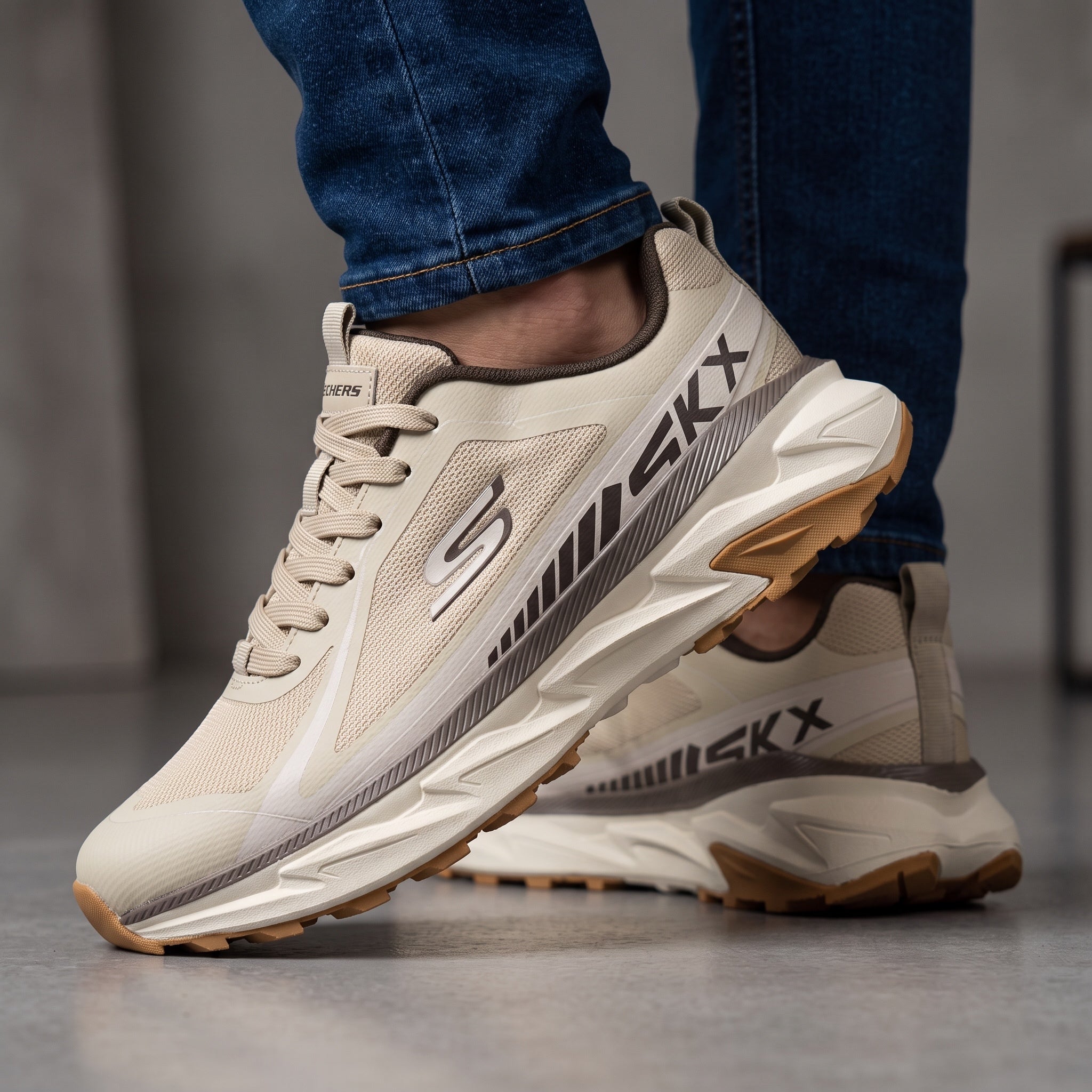 Beige Skechers chunky athletic sneaker with gum outsole and visible side logo