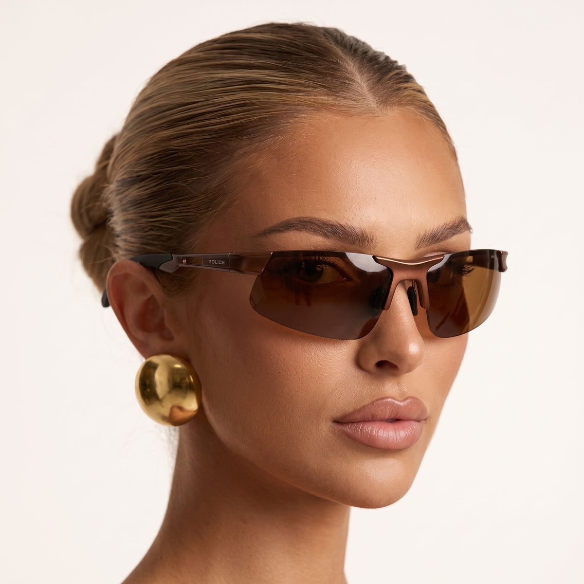 Police brown shield wrap sunglasses with POLICE logo on temple