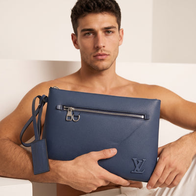navy Louis Vuitton pouch with front zip pocket and wrist strap