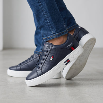 navy Tommy Hilfiger low-top sneakers with white platform sole and logo accents