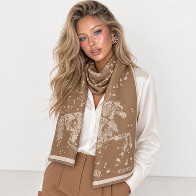 brown Hermes scarf with floral print and H logo draped around model