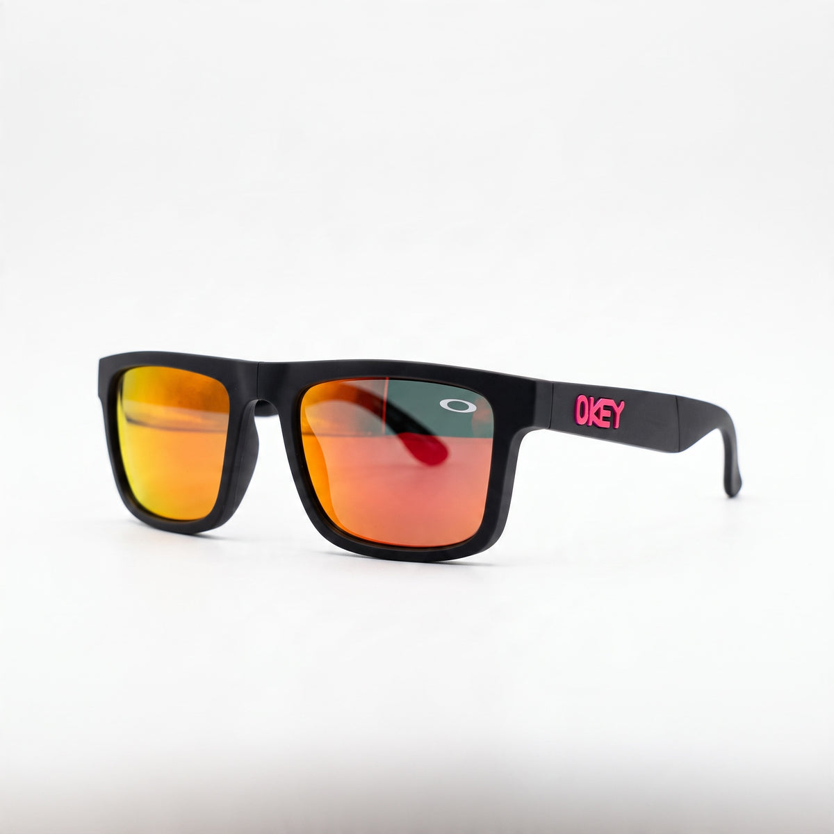 Oakley black square sunglasses with red-orange mirrored lenses and pink OKEY logo on temple