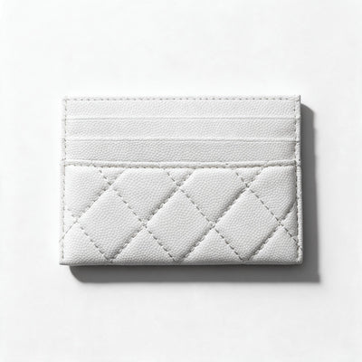 white quilted Chanel card holder with gold CC logo and multiple card slots