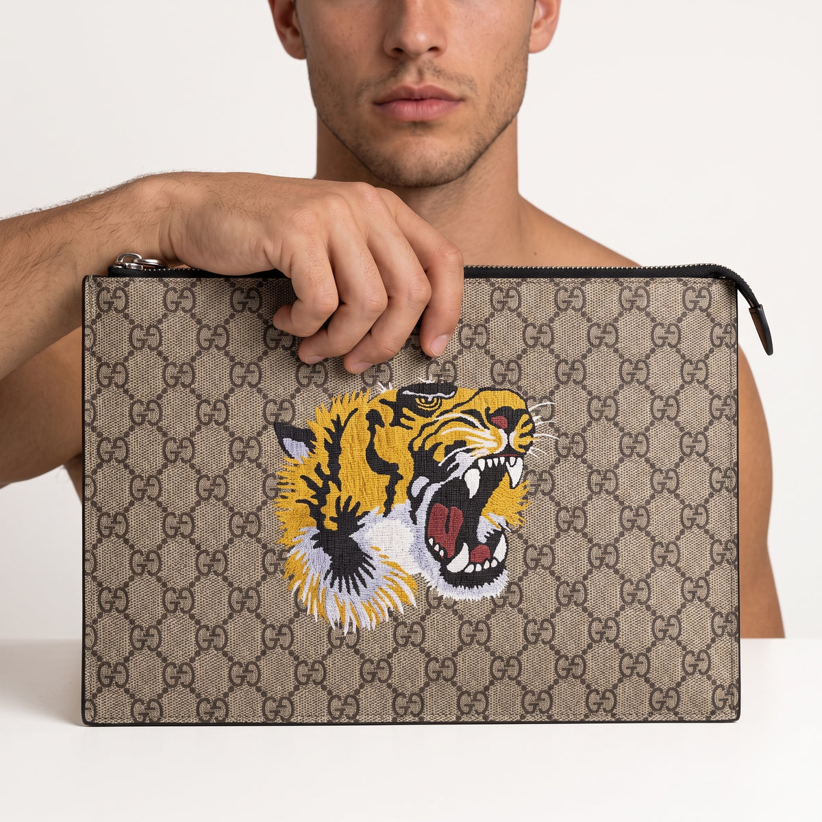 Gucci beige GG monogram pouch with embroidered tiger and top zipper