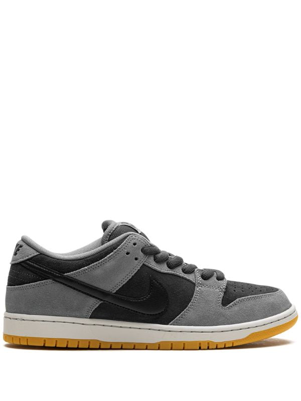 Nike Dunk Low grey and black sneaker with gum sole, side view