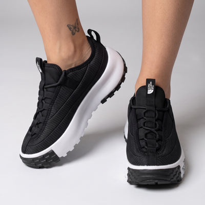 The North Face black platform trail runner with white chunky midsole and lugged outsole