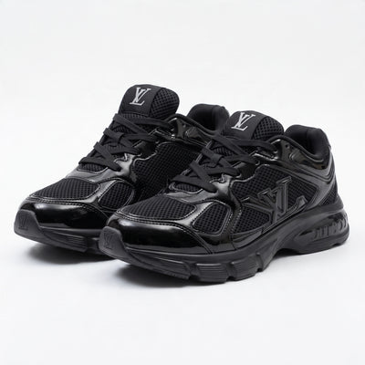 pair of all-black Louis Vuitton chunky sneakers with LV logo on tongue and sole
